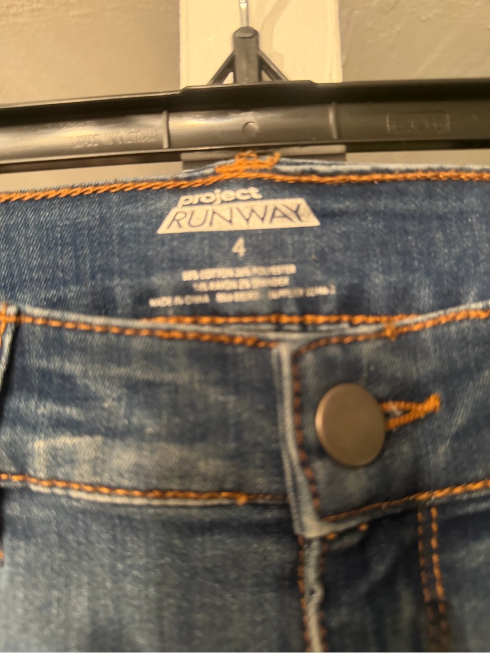 Project Runway women’s Blue Denim Jeans - Size 4 with pink glitter down sides
